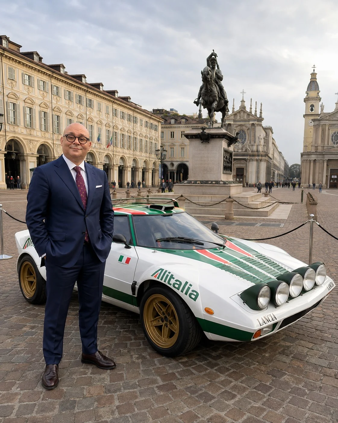 Alessandro Sannini beside a Lancia in Turin